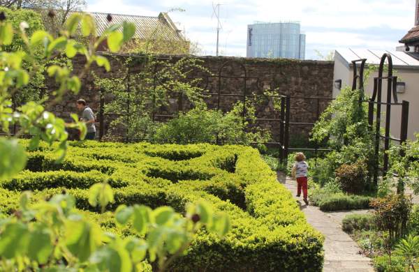 Child playing in the Tudor knot garden at The Red Lodge Museum in Bristol - credit Visit West