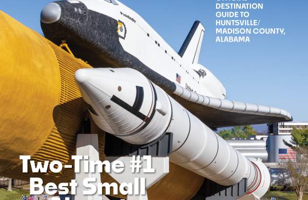 Photo of the space shuttle Explorer at the U.S. Space & Rocket Center on a bright sunny day with clear blue skies.
