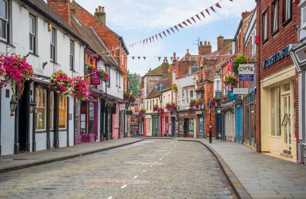A view down the Bailgate, a historic street lined with colourful shops