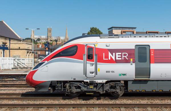 LNER train at Lincoln station with cathedral in distance