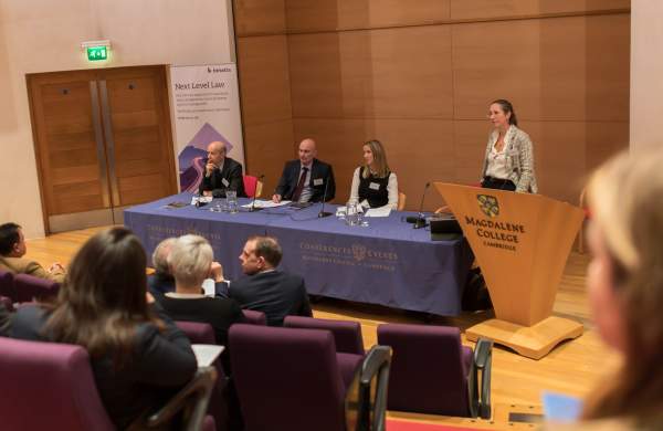 Speakers listening out to the audience at a high profile conference