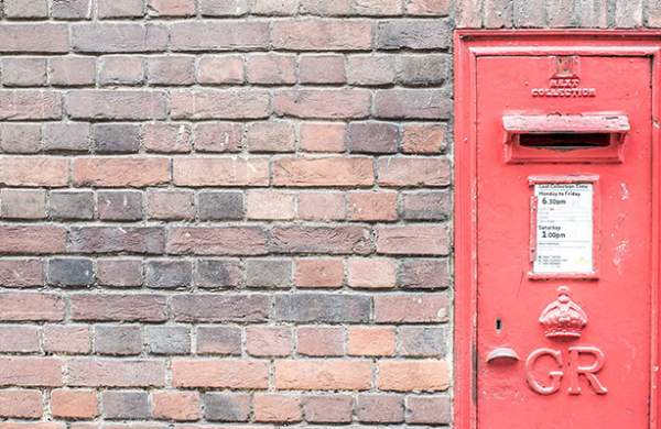 Letterbox against a brick wall