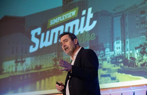 Ken Schmidt giving his keynote presentation at Simpleview Summit 2024.