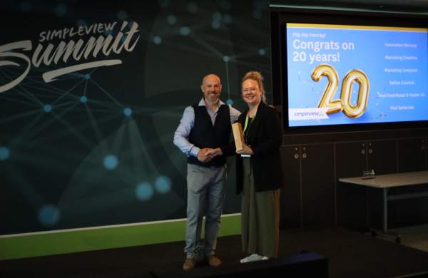 Visit Fredrikstad & Hvaler AS's Hedda Takle receives 20 year client anniversary award from Simpleview MD Richard Veal