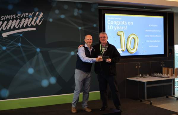Visit County Durham's Andrew Marchbank Accepts 10 Year Award from Simpleview MD Richard Veal