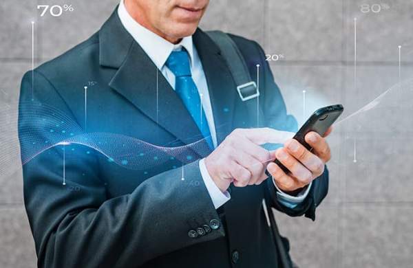 A man scrolling through his phone with a graphic imposed over the photo.