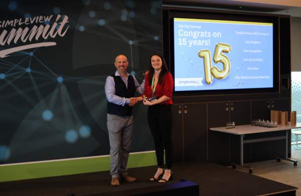 Gina Franchi of English Riviera BID Accepts 15 Year Client Award from Simpleview MD Richard Veal