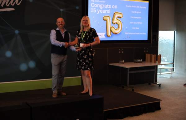 Visit Isle of Wight's Jill Harlow Accepts 15 Year Client Award from Simpleview MD Richard Veal