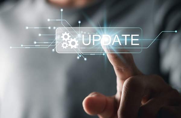 A man's finger with a graphic overlay reading, "Update"