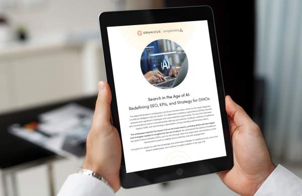 The "Search in the Age of AI: Redefining SEO, KPIs and Strategy for DMOs," whitepaper open to the front cover on an iPad.