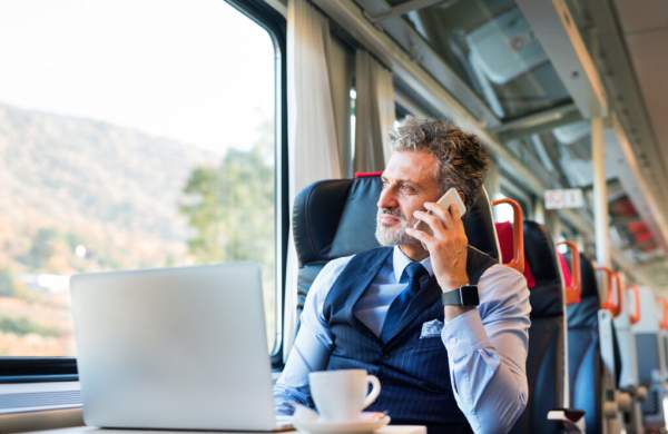 Man using phone on train