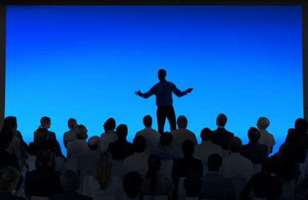 Person speaking to audience