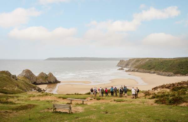 A group of 55+ individuals walking in Gower