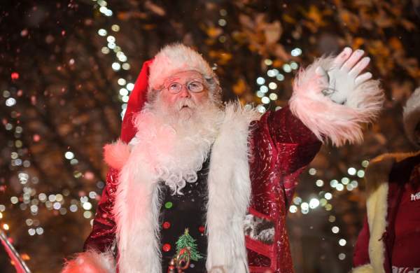 Father Christmas waving from his sleigh in the Swansea Christmas Parade