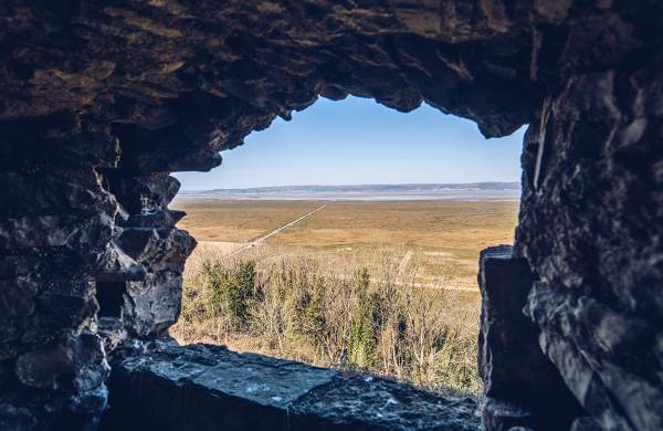 View of Loughor Estuary through a stone window.