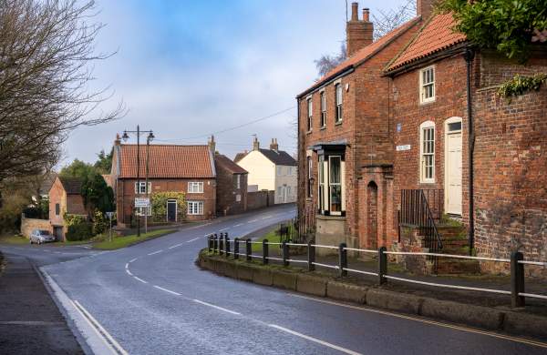 A quiet street in Caistor with houses and road going through the centre
