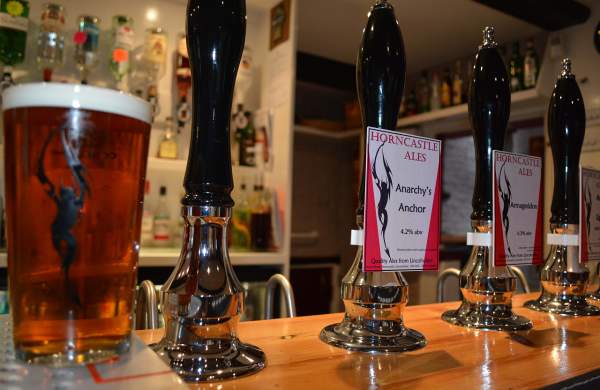 a bar in a pub with 'Horncastle ales' on the pumps