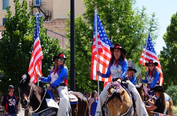 Cowgirls with American Flag at 4th of July Parade