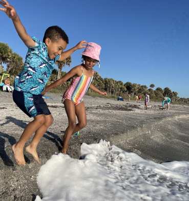 Kids playing on Caspersen Beach near Venice