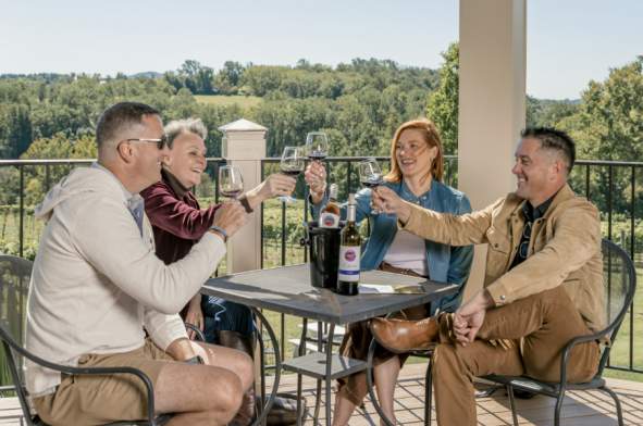 2 couples toasting with wine