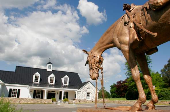 Bronze horse sculpture in foreground outside the National Sporting Library and Museum in Middleburg, Loudoun