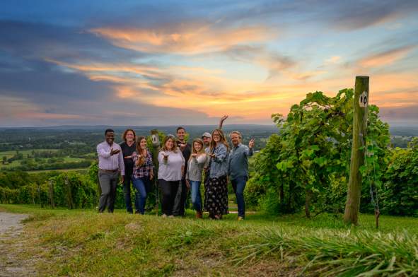 Diverse Group Photo at Winery with Sunset