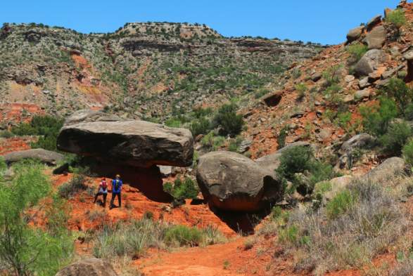 Two people hiking in palo duro canyon state park