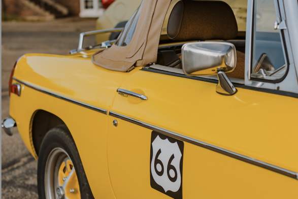 Classic yellow car with route 66 symbol at the Texas Route 66 Festival