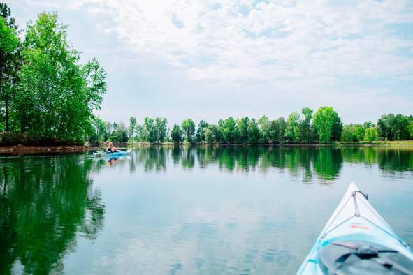 Women paddling on Lake Joanis in Stevens Point, WI.