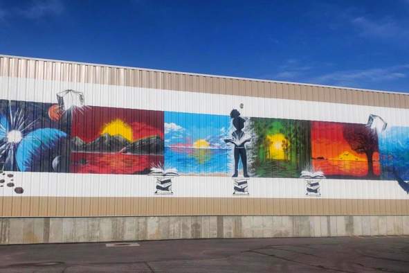 Get to know the local artist behind the Worzalla Books mural, Stephon Kiba Freeman.