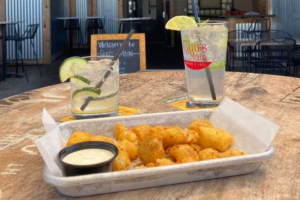 Try the yummy cheese curds at Guu's On Main with a cocktail to wash it down.