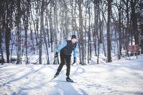 A man cross country skiing at Standing Rocks County Park in Stevens Point, WI