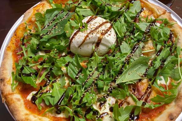 Snag a slice of delicious pizza in the Stevens Point Area, from the Violet Basil.