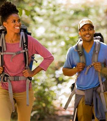 Couple with backpacks hiking the Appalachian Trail
