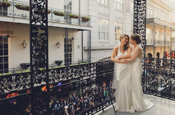 LGBT brides on balcony