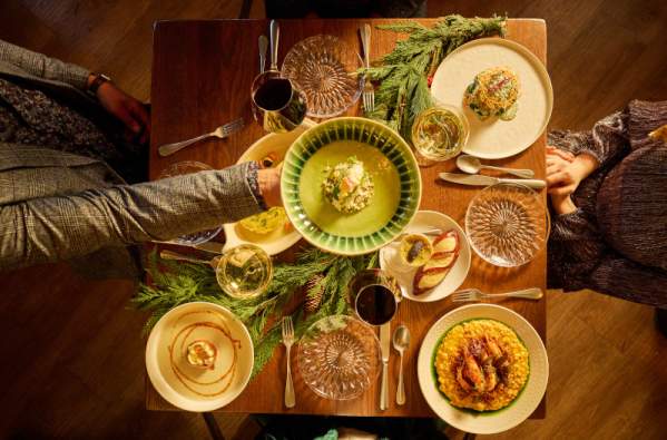 Traditional New Orleans Reveillon dinner at MaMou with seasonal dishes and warm holiday ambiance.
