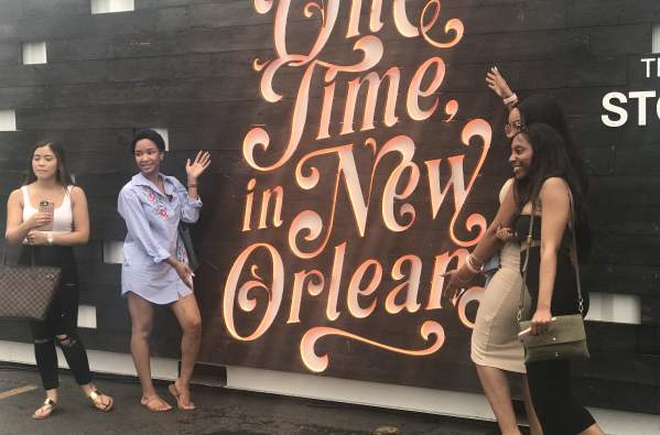2018 French Quarter Festival attendees pose with the One Time in New Orleans Story Booth