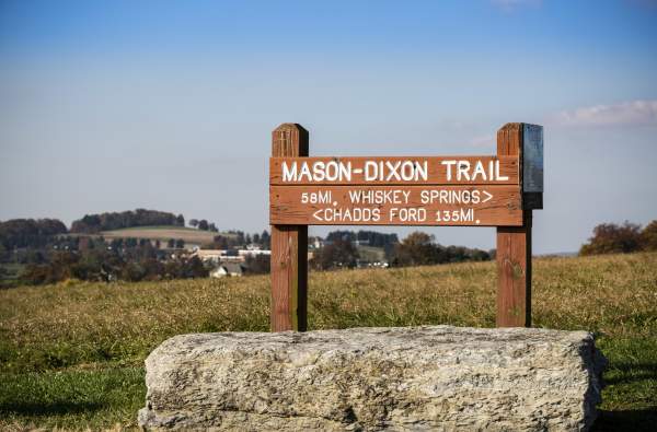 sign at the mason dixon trail showing the way to Whiskey Springs and Chadds Ford