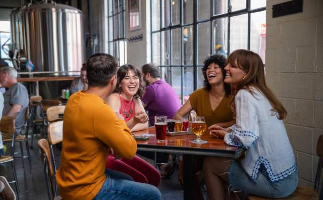 Image of a group of people at Fisher Brewing in SLC