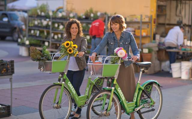 Women Riding GREENbikes with Flowers