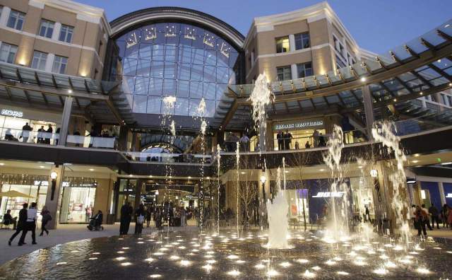 City Creek Center fountain lit up with people around it