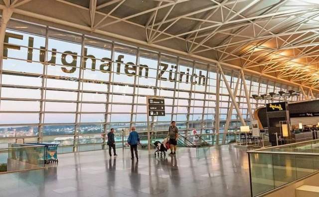 Airport concourse at Zurich looking out the windows at the city