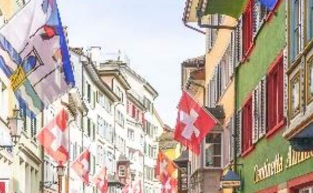 Colorful street in Zurich with flags and colorful buildings