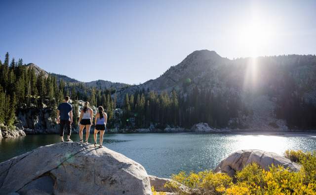 Friends hiking to a lake in Big Cottonwood Canyon