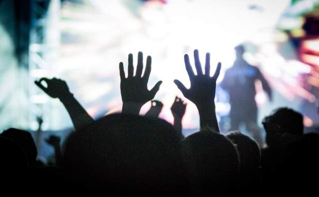 Salt Lake City Concert-goer in the crowd raising their hands