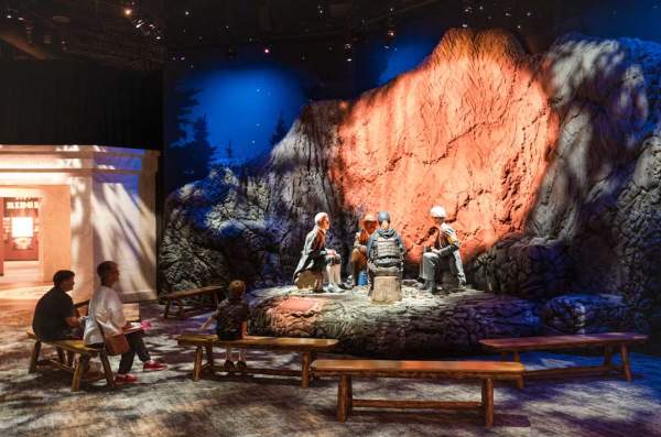 Visitors watching Marshal's campfire