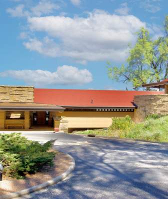 A wide view of Frank Lloyd Wright's home Taliesin, a building with strong geometric shapes and designed in reference to the nature around it.
