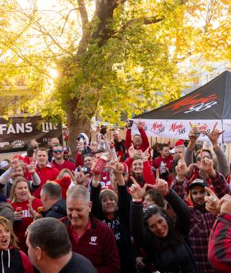 Badger sports fans cheering outside on a sportscursion