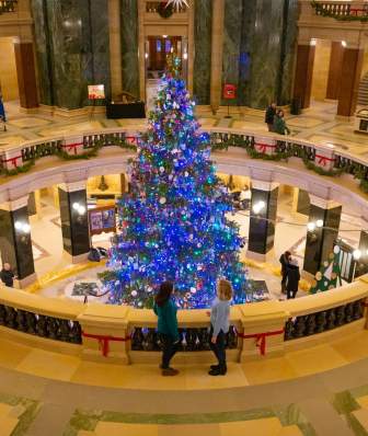 A view from above of the lit up holiday tree in the Wisconsin State Capitol rotunda