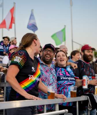 A group of fans celebrate in the stands at a Forward Madison soccer game